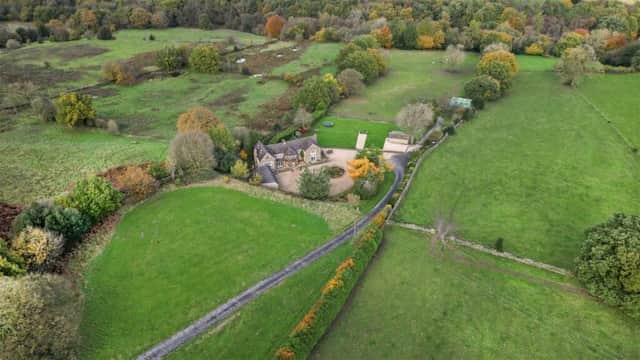The property on Robridding Road, Ashover nestles in glorious countryside.