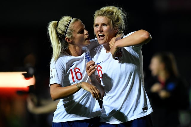 Rachel Daly and Millie Bright of England celebrate at the final whistle during the Women's World Cup qualifier between Wales Women and England Women in Newport in 2018.