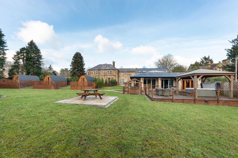 The properties are set within extensive mature gardens and grounds of approximately one acre which include a large decked terrace, incorporating covered hot tub and barbecue area, along with children's play area and three timber pods, used as additional storage.