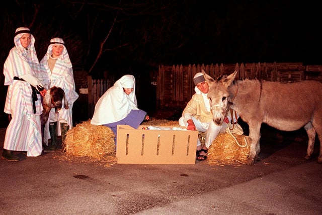 Members from Christchuch, Stannington, re-enacted the nativity with a nativity tour of the village complete with real animals in 1998. This shows Mary and Joseph tending to baby Jesus in the barn scene in the car park of the Crown and Glove public house.