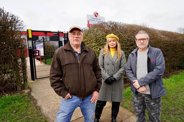 Local residents Andrew Parsons and Daryl Yeates with Cllr Anne Frances Hayes in front of Polsbrook Primary Academy affected by the odour from the landfill site.