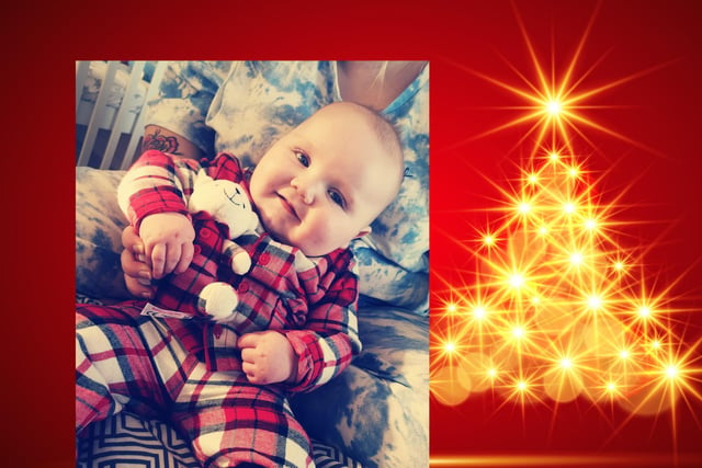 Ollie-Lee, age seven months, shows off his Christmas pjs.