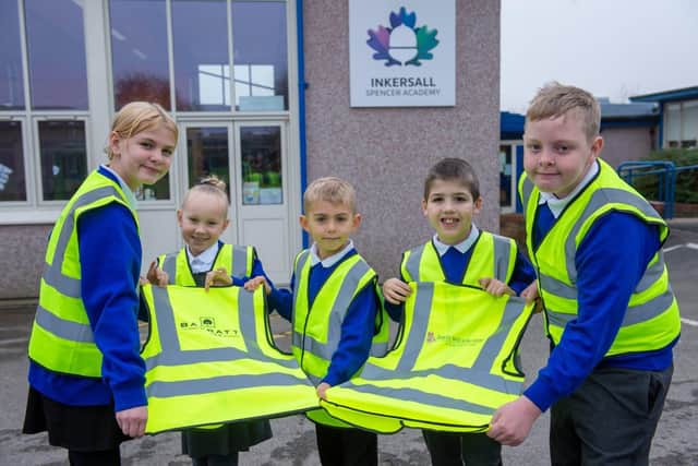 The pupils at Inkersall Spencer Primary Academy with their hi vis vests