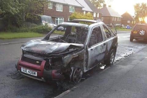 The Land Rover Discovery after it was set alight in Newbold, Chesterfield.