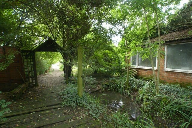 The house is set in half an acre of grounds which contain a good-sized pond.