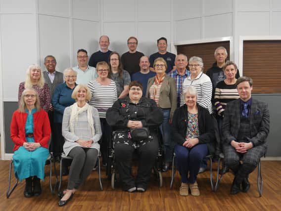 Members of Chesterfield Gilbert and Sullivan Society are pictured with musical director Adam Green who is on the right of the front row (photo: Albert Thomas).