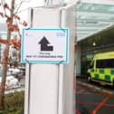 A sign directs patients towards an NHS 111 Coronavirus (COVID-19) Pod - (Photo by ISABEL INFANTES/AFP via Getty Images)