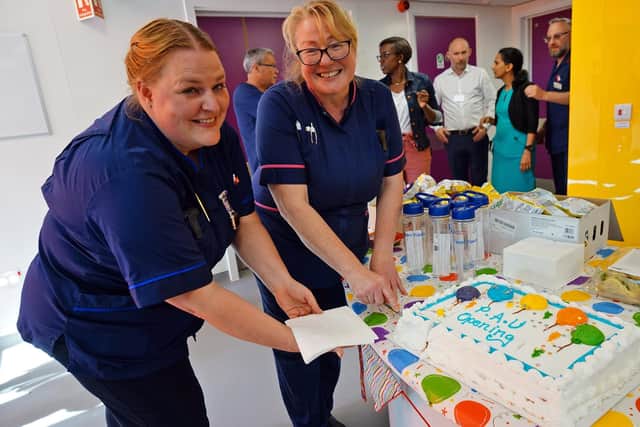 Cutting the cake, Michelle Swan senior matron and Tracy barker lead nurse family care.