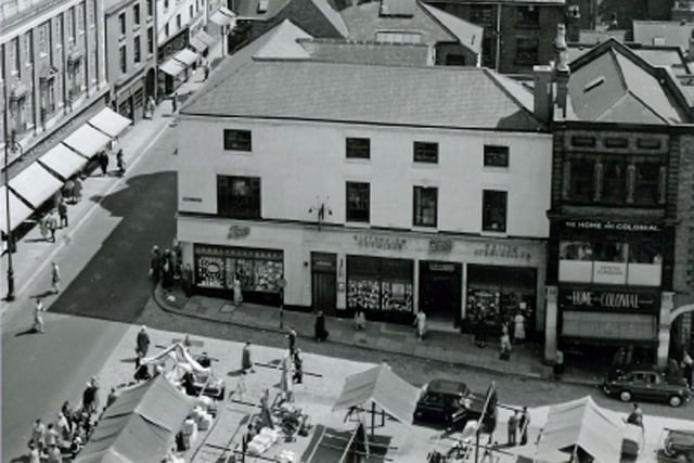 This 1950s vierw of Chesterfield town centre shows shops and the corner of the market