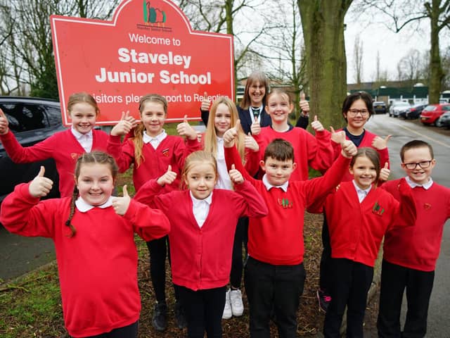 Pupils and staff at Staveley Junior School are celebrating a ‘good’ Ofsted report following a recent inspection. Above is headteacher Sue Parkes with members of the school parliament.