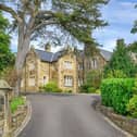 Stone pillars flank the entrance to the drive that leads up to the distinguished Victorian property.