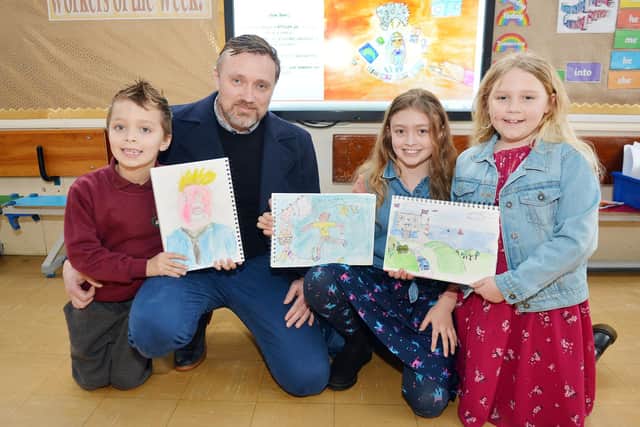 Dad Ian Butler with children Reuben, Amelia and Eden, have created an online book to help children with their mental health.