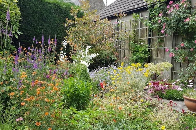 A cottage-style garden area in the 0.4-acre plot.
