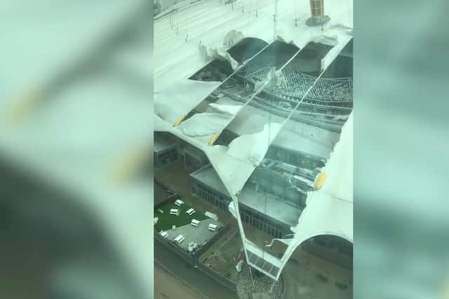 Part of the roof of London's O2 Arena has been ripped of by severe winds of Storm Eunice (Credit:@ BJFHubbard)
