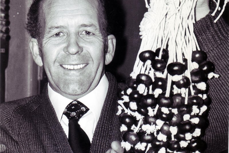 Pat Ryan with the vital ingredients for the first heat of a conker competition at the Peacock Inn, Brampton, in 1981.