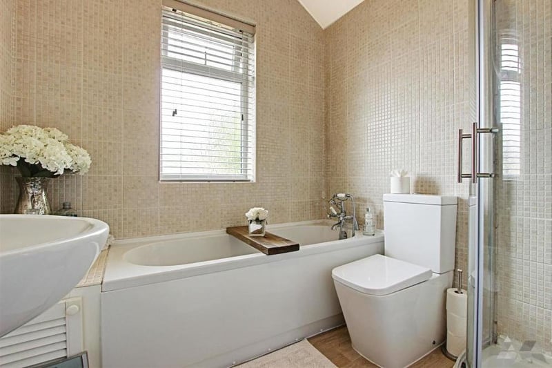 The family bathroom is a super highlight of the property. It features bath, separate walk-in shower, WC and wash hand basin.