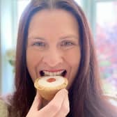 Jen Bell tucks into an Iced Cherry Bakewell Tart at The Bakewell Tart Shop which has declared June 26 will be National Bakewell Tart Day.
