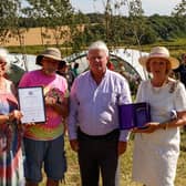 Liz Brown and Alan Wood, long-serving volunteers of the Stainsby Folk Group charity, holding the Royal Citation for the Queen's Award for Voluntary Service, are pictured with Tony Trafford, chairman of the trustees, Nick Hodgson, Deputy Lieutenant, and Elizabeth Fothergill, the Lord Lieutenant of Derbyshire, pleft to right.