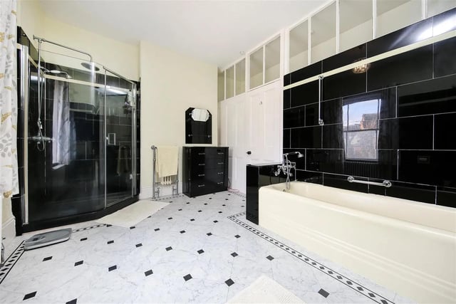 The second impressive tiled black and white bathroom
