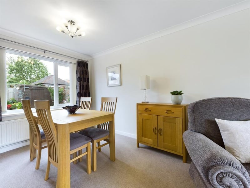 Lounge/dining room - Double aspect room with uPVC double glazed window to the front elevation, feature fireplace with inset and raised hearth incorporating electric fire unit, uPVC double glazed window to the rear elevation, two radiator panels and power points.