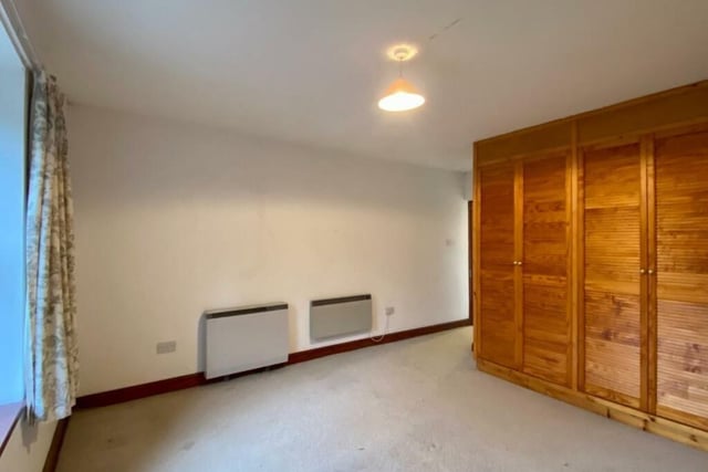 Fitted wardrobes are a feature of this bedroom which overlooks the front of the house.