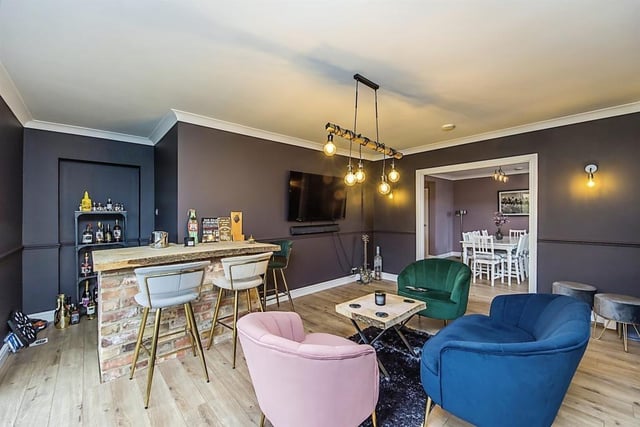 This second reception room has been converted into a bar area, with French doors that lead out to the back garden. Just like being in your local!