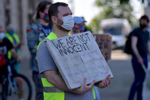 A demonstrator wears a face mask in Keel Square.