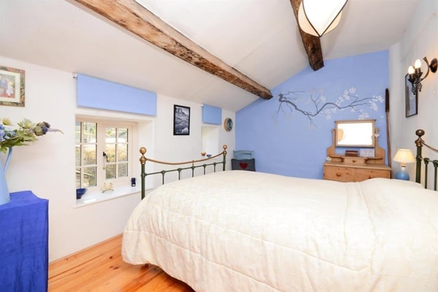 Enjoy looking out onto the rear garden from this pretty bedroom.