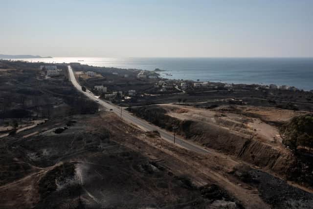 An aerial view shows Kiotari village, on the island of Rhodes on July 24, 2023. Tens of thousands of people have already fled blazes on the island of Rhodes, with many frightened tourists scrambling to get home.