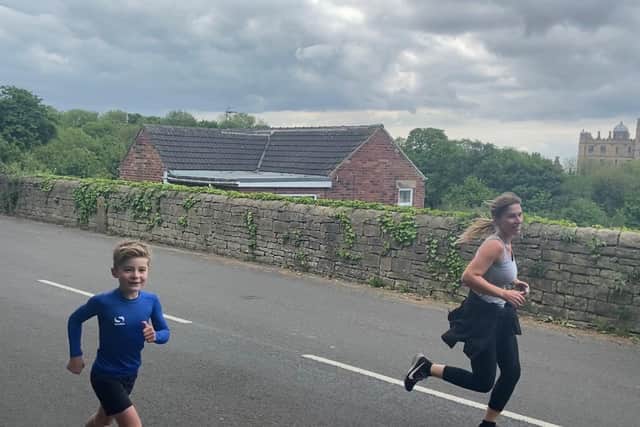 Jacob Fidler running with mum Maria.