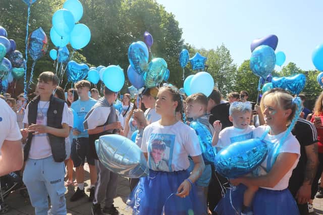 People gather in Staveley on Saturday to remember Logan Folger.