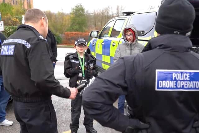 Jay and his brother learning from the police drone operators at Derbyshire HQ.