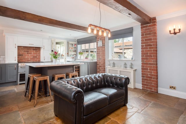 "The expansive kitchen has recently been modernized to a very high standard, with lovely views looking out towards the courtyard via the timber double glazed windows," says the brochure.