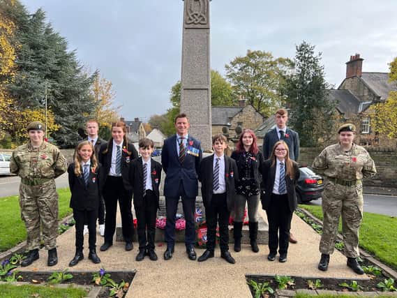 Pupils from Eckington School pictured with headteacher Nick Melson at the War Memorial outside St Peter and St Paul's Church in Eckington