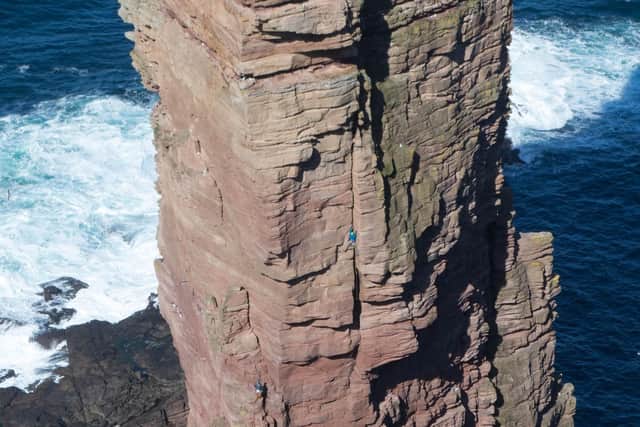 Sam and Steve pictured scaling the Old Man of Hoy in the Orkey Isles