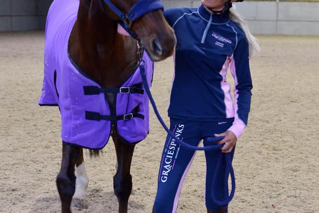 Model Iona Brookes modeling part of the Gracie Spinks Collection with Gracie's horse, Paddy