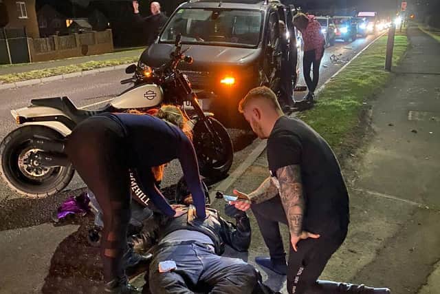 Paul Rodgers pictured being treated at the side of the road after the accident on Wednesday, February 2 (photo used with permission)