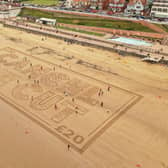 This aerial picture shows the campaigners' message in the sand at Bridlington.