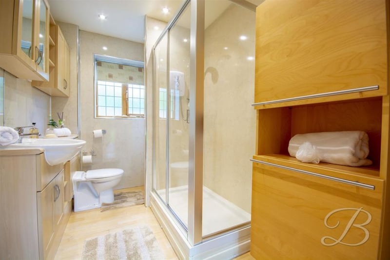 The annexe also benefits from this shower room. It features an enclosed shower, vanity unit, wash hand basin and low-flush WC, plus a cupboard for storage.