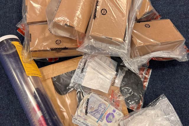 Police have arrested 13 people after a series of raids in Chesterfield and Sheffield found drugs, cash, and weapons. Image: Derbyshire police.