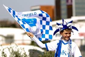 A young chesterfield fans waves a flag prior to the Johnstone's Paint Trophy Final between Chesterfield and Peterborough United at Wembley Stadium on March 30, 2014.