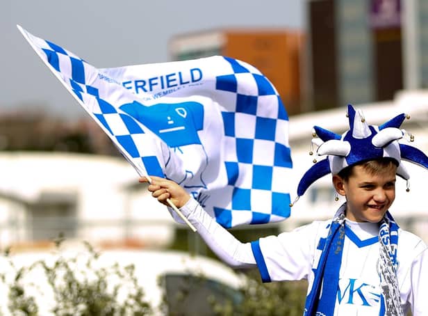 A young chesterfield fans waves a flag prior to the Johnstone's Paint Trophy Final between Chesterfield and Peterborough United at Wembley Stadium on March 30, 2014.