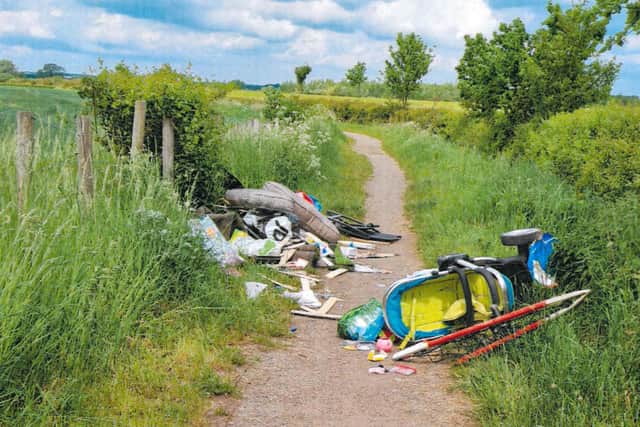 The defendant’s rubbish was dumped on a country path after she paid someone without a licence to remove her waste.