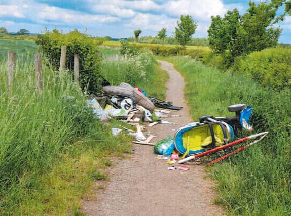 The defendant’s rubbish was dumped on a country path after she paid someone without a licence to remove her waste.