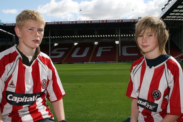 Blades fans Jordan & Max Hind get close to the pitch.