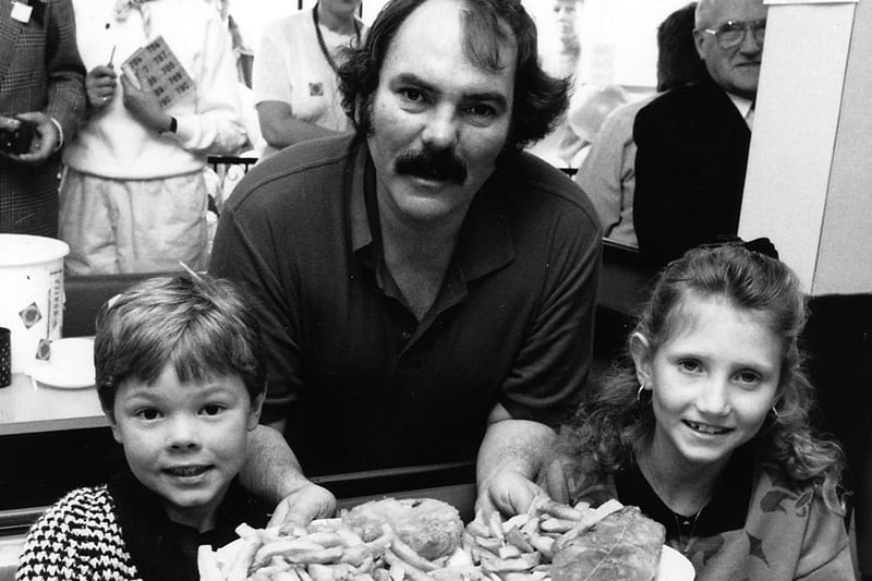 Actor Kevin Lloyd serves chips at Crest of the Waves, Ripley