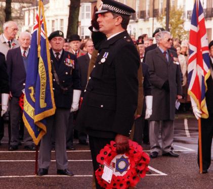 Brian Mordue , Police officer laying a poppy wreath on Remembrance Day, 1998.