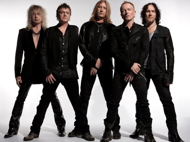Born on November 1, 1963, Rick Allen (pictured second from left) attended Dronfield Henry Fanshawe School and began playing drums at age nine before later joining Def Leppard in 1978. He overcame the amputation of his left arm seven years later and continues to play with the band to this day. He is known as 'The Thunder God' by fans and is ranked seventh on the UK website Gigwise in The Greatest Drummers of All Time list.