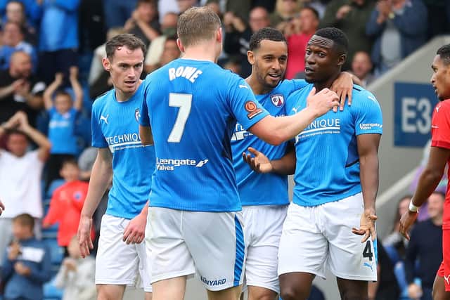 Manny Oyeleke, pictured right, is back in training for the Spireites.