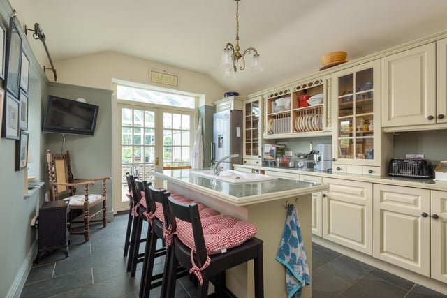 The kitchen is located towards the back of the property, with only the conservatory between it and the garden.